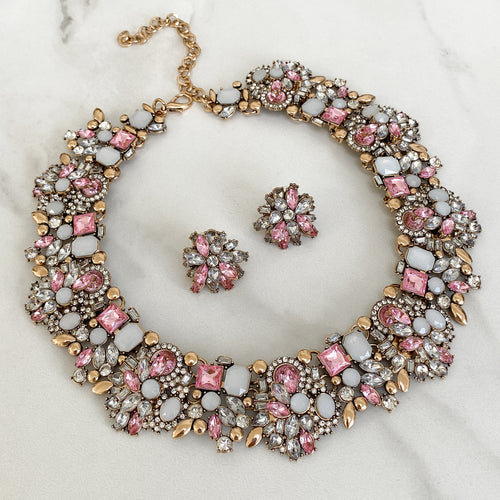 pink and gold necklace set featuring statement necklace and stud earrings