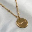 18k Gold disc pendant on satellite chain for her
