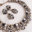 black and gold earrings and matching necklace